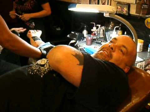 Hot towel to the tattoo.