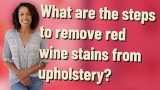 What are the steps to remove red wine stains from upholstery?