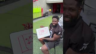 REDBLACKS players try to draw the Canadian flag