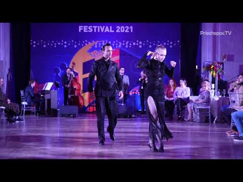 Liza Rosales  and  Juan Manuel Rosales  are  dancing  to  the  nontraditional song  "  Zum  "  by  Solo Tango Orquesta  at  La Boca Tango Festival  in  2021