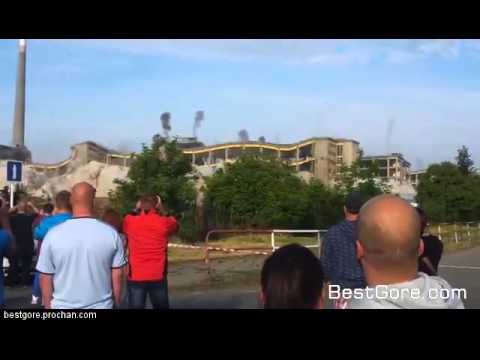 (close call) Czech Republic building demolition - flying rock misses crowd
