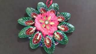 Wall hanging flowers with spoons & waste CDs