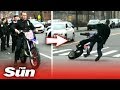 Embarrassing moment NYC cop falls off dirt bike