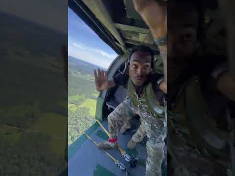 Jumpmaster Sends Paratroopers out of Helicopter