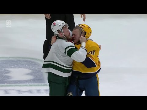 Mark Borowiecki drops the gloves with Nic Deslauriers right after face off