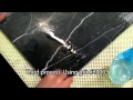 Black marble tile cleaning by hand pads