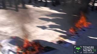 Protesters led by anti-LGBT activist Zhenish Moldokmatov burn images of "gay propaganda" at a protest in front of the U.S. Embassy in Bishkek in February 2014.