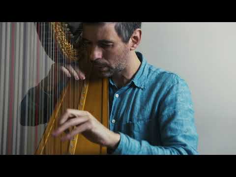 Josh Layne performs "Fum, Fum, Fum" on the harp