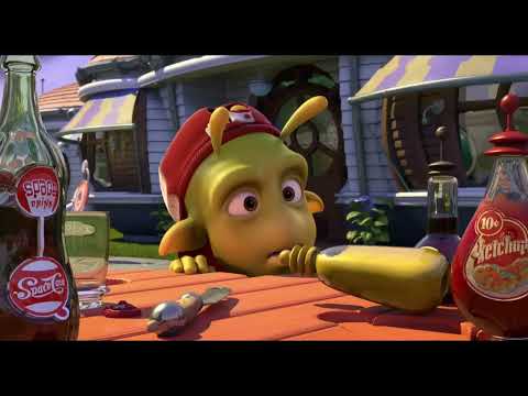 Planet 51 official trailer frame: astronaut Chuck sprints through a 1950s-style alien suburb as martial cues swell