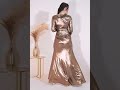 Showing Off Your Baby Bump With A Long Sleeve Plunge Neck Foil Maxi Dress