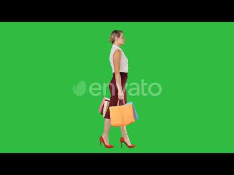 Happy full length woman holding paper shopping bags in | Stock Footage - Videohive