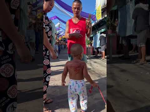 Mandarame and the young: Children in Angeles City mimic flagellation