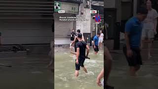 Macau residents fish in flooded streets after typhoon