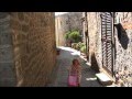 Cute 2 Year Old Chatting In A Medieval Tuscany Village Italy