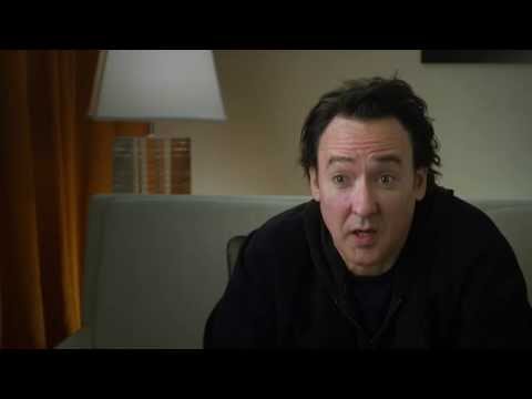 John Cusack in Boom Bust Boom