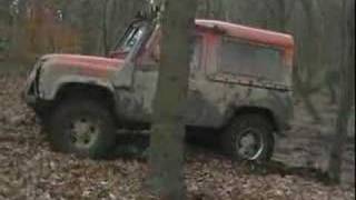 4x4 defender landrover driving through a peat bog at frickle