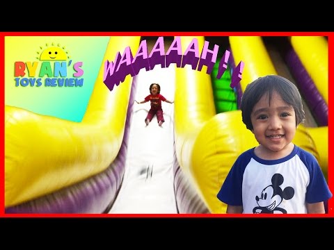 Ryan plays on HUGE Indoor playground GIANT INFLATABLE SLIDES Video