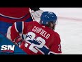 Canadiens' Cole Caufield Leaves Game After Big Collision With Flames' Trevor Lewis