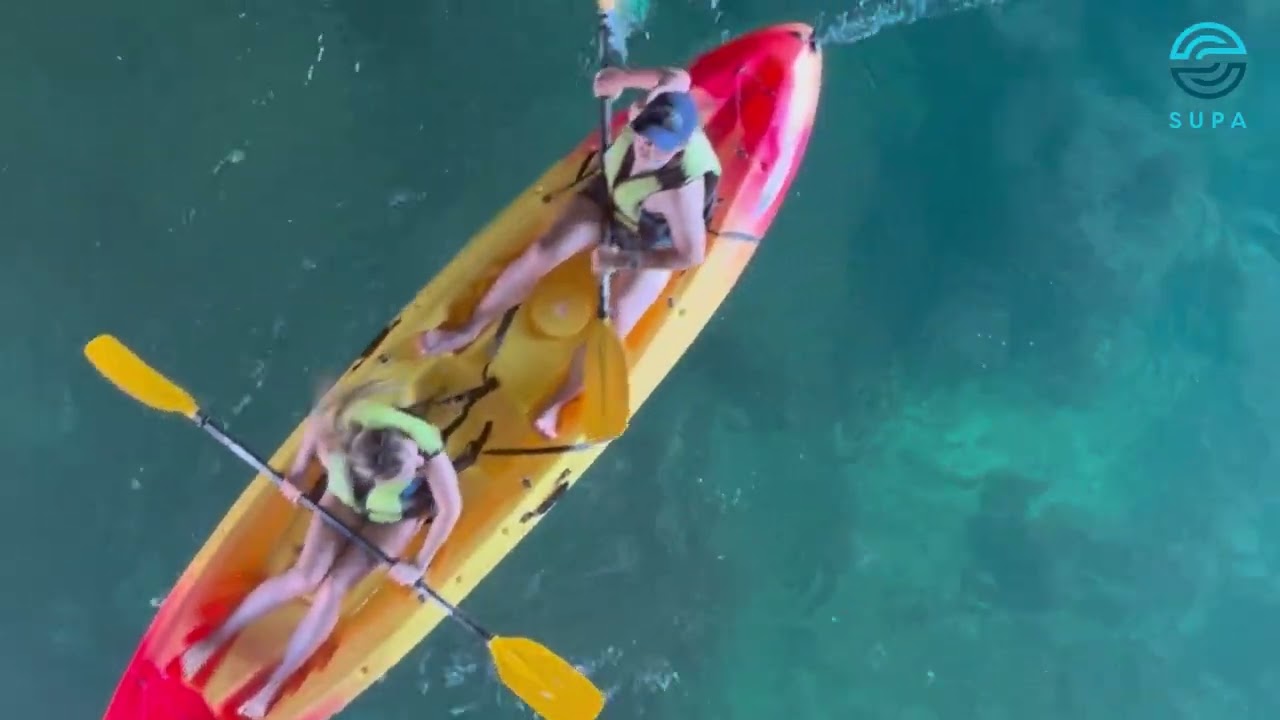 Discover hidden caves by kayak in Algarve.