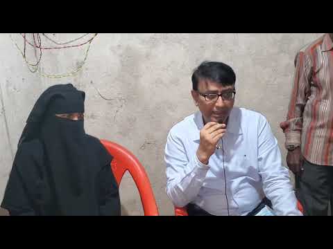 Amjed Ullah Khan helps a mother of six daughters whos house has been damaged in Rains.