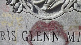 Kevin Grace visits the grave of Divine at Prospect Hill cemetery in Towson