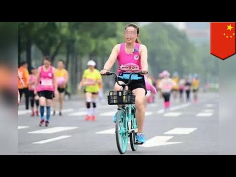 Women busted riding bikes in China half-marathon - TomoNews Video