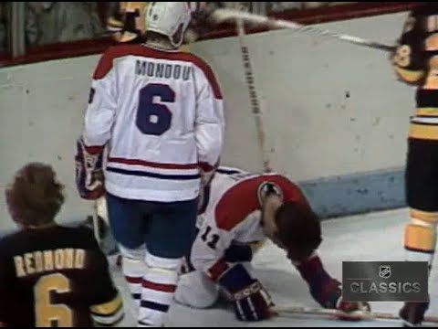 Bruins Mike Milbury crushes Montreal's Yvon Lambert who recovers to score playoff winning OT goal