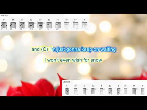 All I Want for Christmas is You by Mariah Carey play along with scrolling guitar chords and lyrics