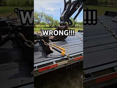 Part of a video titled Proper Compact Mini Excavator Securement! #johndeere #towing ...