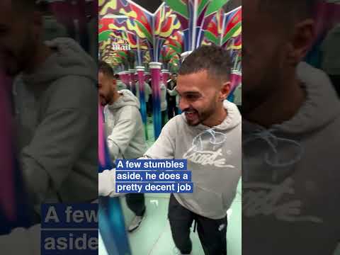 Confident man attempts speed round in mirror maze