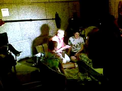 Carl from Queer Eye interviewing brides camping out for cheap wedding dresses.