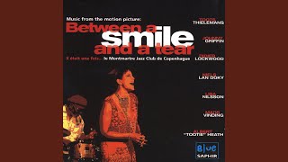 Between A Smile And A Tear