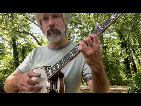 guy holding a banjo