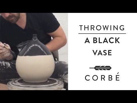 Throwing a Black Vase on the Pottery Wheel