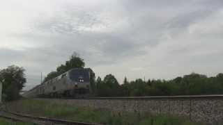 preview picture of video 'CP, CN and Amtrak trains hammering the Duplainville Diamond 5/25/13'