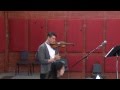 Son plays violin at Father's funeral