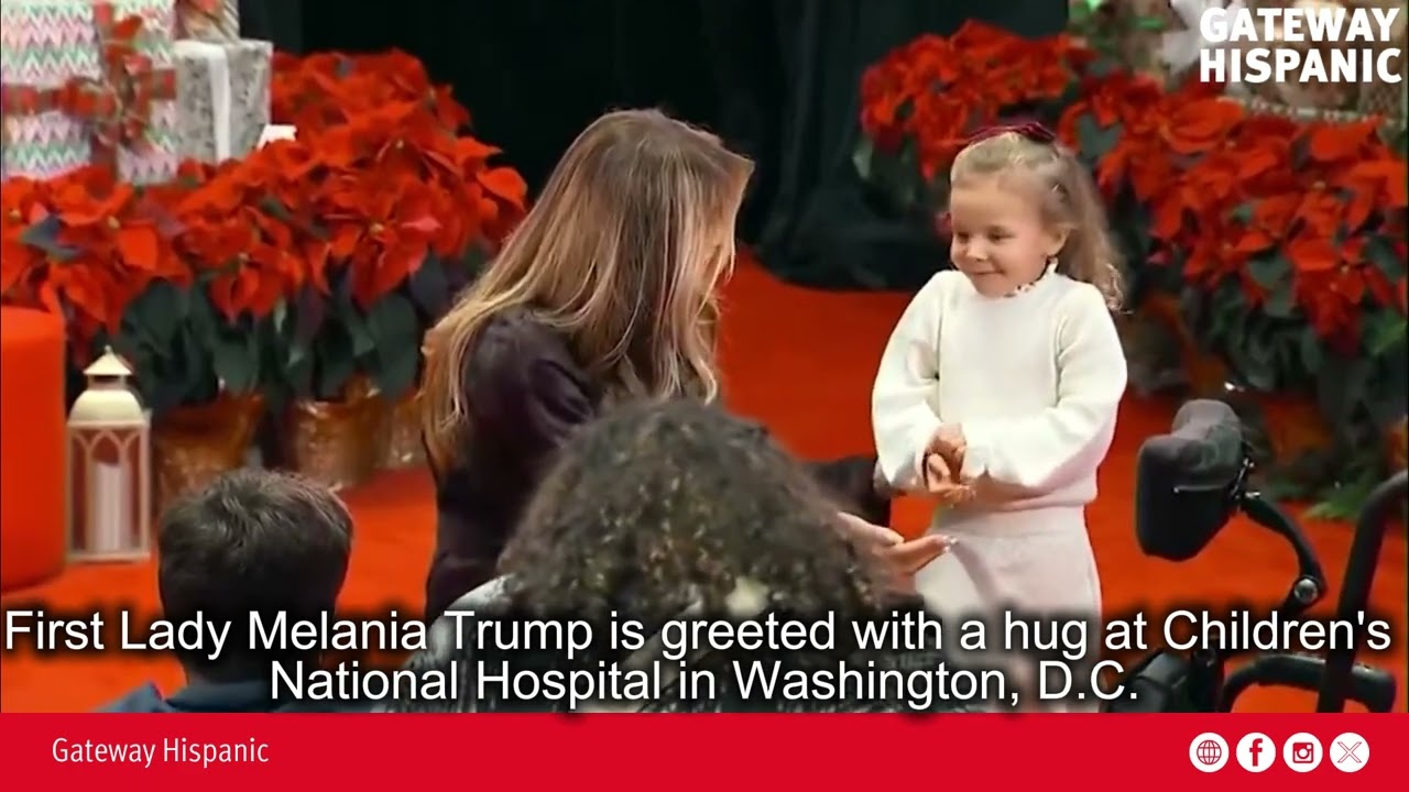First Lady Melania Trump is greeted with a hug at Children's National Hospital in Washington, DC