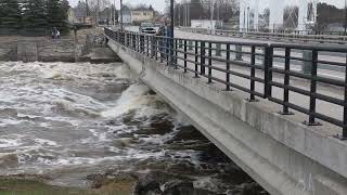 Water rushes through dam in Alpena