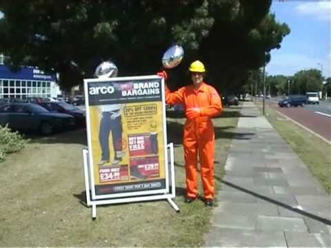 Living Mannequin Arco Open Day Orpington mannequin-man performming as a Mechanical Mannequin: mannequin man at Arco's Orpington Event Day 2008, pretending to be an automated robot waving to traffic for Arco on 27/06/2008