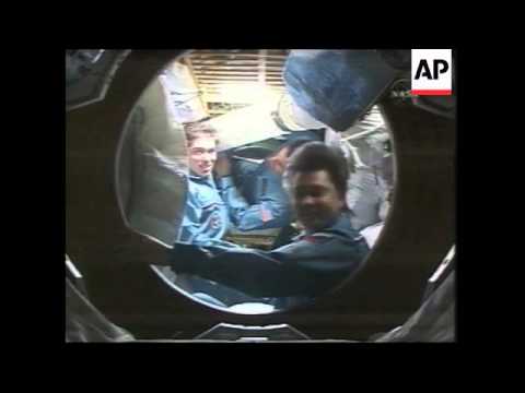 Soyuz carrying space tourist and crewmates docks