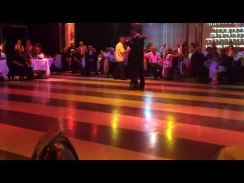  Santiago Fina  and  Samantha Dispari  are  dancing  to  a  tango
