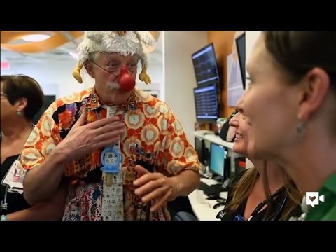 Patch Adams and clowns spreading laughter at hospital