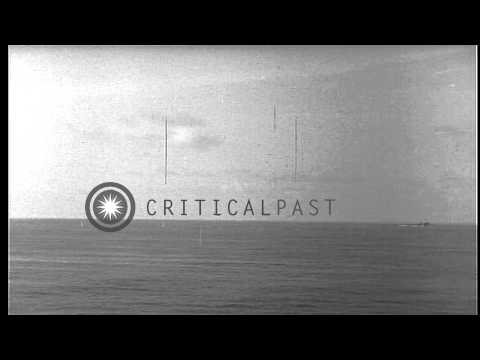 Japanese A6M Zero fighter aircraft strafes USS Sangamon. HD Stock Footage