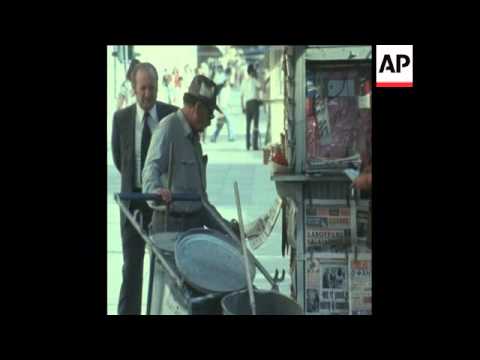 SYND 16 7 74 PEOPLE IN ATHENS READING ABOUT MILITARY COUP IN CYPRUS