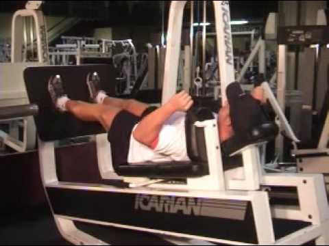 Quads - Lying Machine Squat ATHLETES.COM