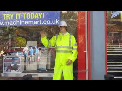 Mechanical Waving Machine Mart Mannequin Man mannequin-man performming as a Living Mannequin: Mechanical waving mannequin man at the 2014 London Marathon at the Docklands Machine Mart Store for Machine Mart on 13/04/2014