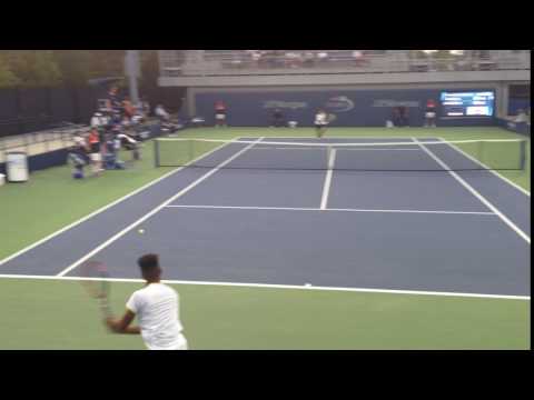 Ilkel Approaches the Net, Mmoh Goes Right at Him