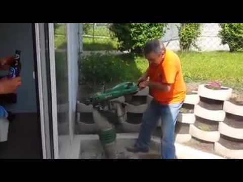 Man tries to drink beer while doing construction