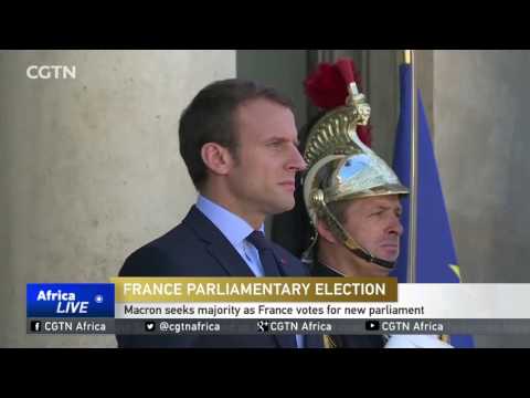 Macron seeks majority as France votes for new parliament