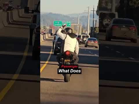Driver can't understand biker's sign language